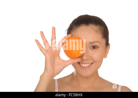 Happy asian woman avec orange Banque D'Images