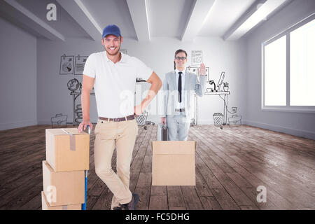 Composite image of delivery man leaning on trolley de boîtes Banque D'Images