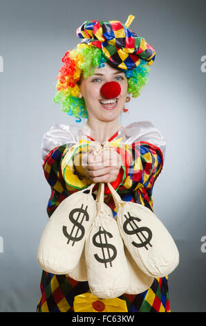 Clown avec de l'argent sac dans concept drôle Banque D'Images