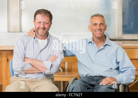 Portrait businessmen smiling in office Banque D'Images