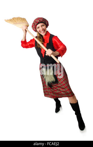 Femme drôle en vêtements écossais avec broom Banque D'Images