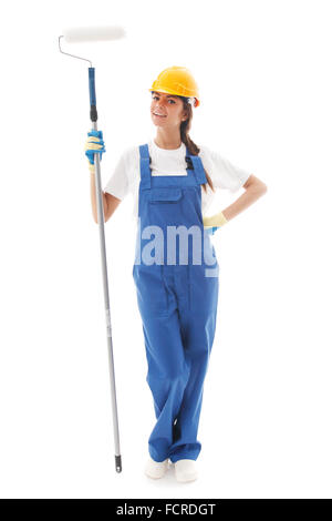Jeune belle handywoman avec rouleau à peindre isolated on white Banque D'Images
