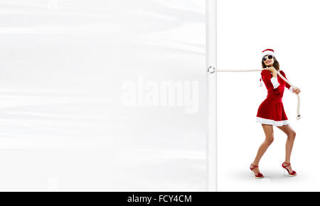 Girl in Santa costume blanc tirant ouverture vierge. Place pour le texte Banque D'Images