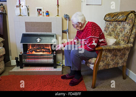 Pensionné lever le voile sur un feu électrique Banque D'Images