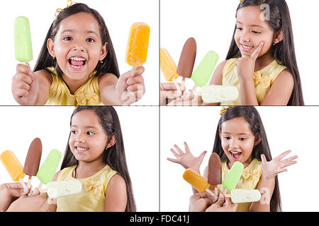 1 Indian kid girl eating délicieuses glaces l'expression faciale montage photo Banque D'Images