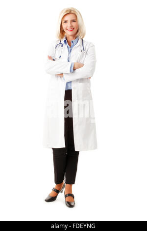 Portrait de senior female doctor standing against white background. Banque D'Images