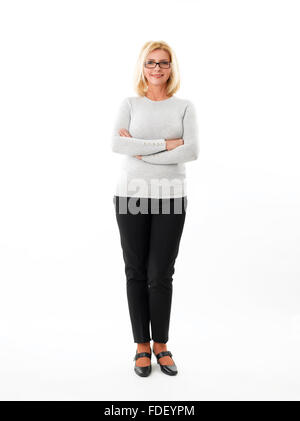 Full Length portrait of young woman standing against white background. Banque D'Images