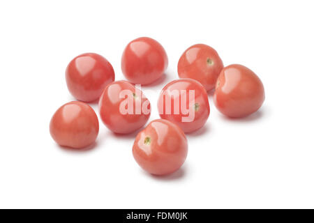 Tas de tomates rose sur fond blanc Banque D'Images