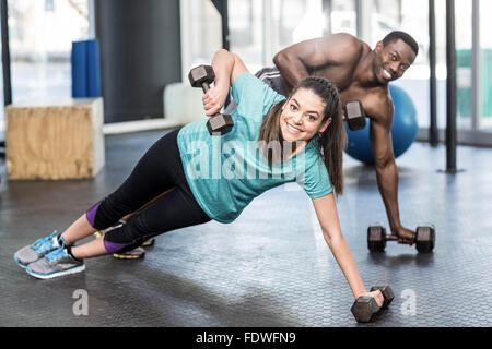 Athletic man and woman working out Banque D'Images