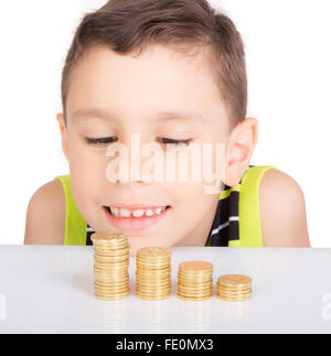 Happy kid avec pièces d'or Banque D'Images