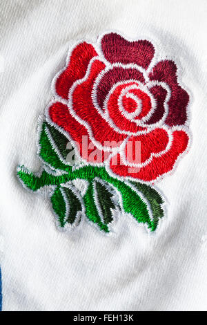 Logo Angleterre Rugby - logo Red rose cousu sur blanc Angleterre Rugby officiel produit sous licence bébé pousser Banque D'Images