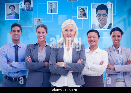 Image composite des gens d'affaires avec les bras croisés smiling at camera Banque D'Images