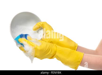 Close up de femmes dans les mains des gants en caoutchouc de protection jaune bol blanc lavage avec une éponge de nettoyage bleu blanc contre Banque D'Images