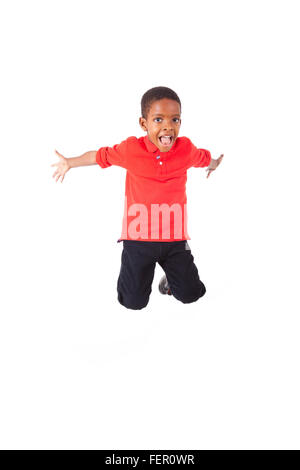 Portrait of a cute african american boy jumping, isolé sur fond blanc Banque D'Images