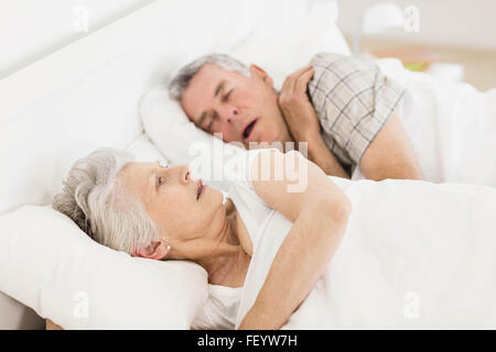 Awake senior woman in bed Banque D'Images