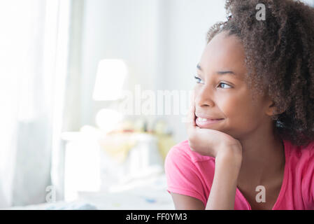 Mixed Race woman smiling indoors Banque D'Images