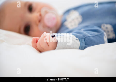 Caucasian baby girl with pacifier Banque D'Images