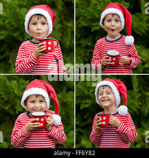 Collage de sweet boy in striped shirt with santa hat, holding cup avec plateau en plein air, l'hiver, de bonheur et d'émotions concept Banque D'Images