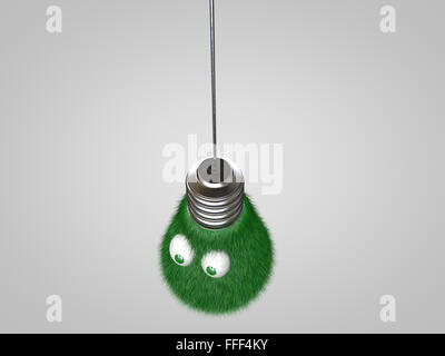 Ampoule avec les yeux couverts dans l'herbe verte. Banque D'Images