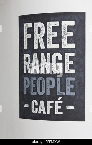 Gamme de personnes Café Sign in London Neal's Yard Banque D'Images