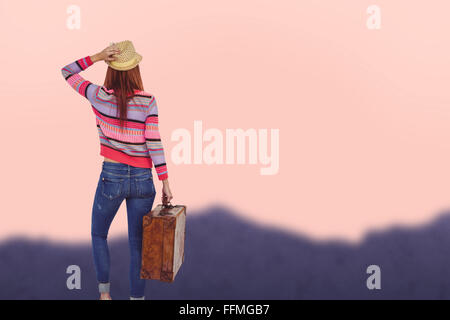 Image composite de la vue arrière d'un hipster woman holding suitcase Banque D'Images