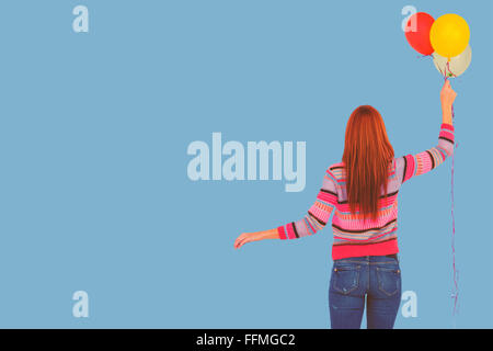 Libre de hipster woman holding balloons Banque D'Images