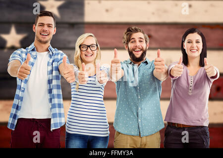 Image composite de portrait of smiling business people with Thumbs up Banque D'Images