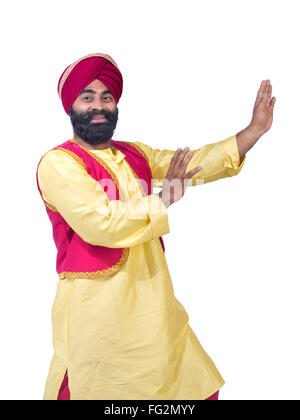 Homme Sikh effectuant la danse folklorique bhangra M.# 779A Banque D'Images