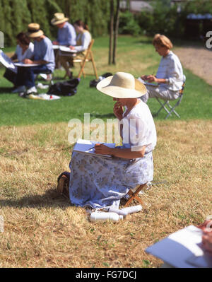 Groupe artiste esquisse sur Thames River Bank, Sonning, Berkshire, Angleterre, Royaume-Uni Banque D'Images