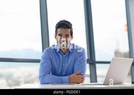 Happy young man at office Banque D'Images