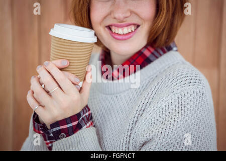 Hipster smiling woman holding a Coffee cup Banque D'Images