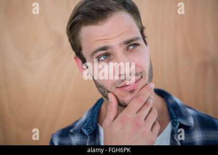 Beau hipster with hand on chin Banque D'Images