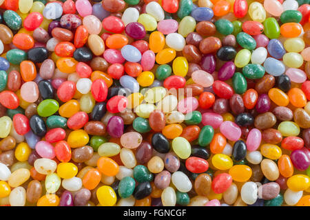 Bonbons bonbons haricots colorés donnent sur l'arrière-plan, voir Banque D'Images