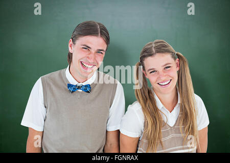 Composite image of geeky hipsters looking at camera Banque D'Images