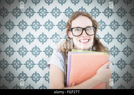 Image composite de hipster geek woman holding files Banque D'Images