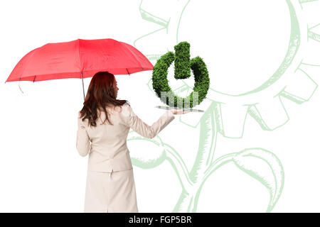 Image composite de femme avec parapluie et livre de pelouse Banque D'Images