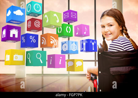 Image composite de girl sitting in wheelchair in school Banque D'Images