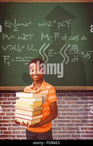 Image composite de portrait of cute boy carrying books in library Banque D'Images