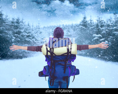 Image composite de la vue arrière d'un hipster woman with arms outstretched Banque D'Images