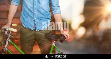 Image composite de portrait de hipster debout avec location Banque D'Images