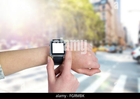 Composite image of woman using smartwatch Banque D'Images