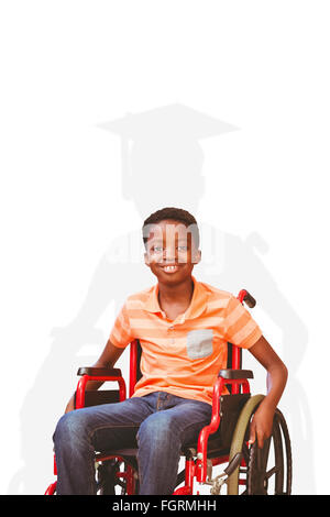 Portrait of boy sitting in wheelchair at library Banque D'Images