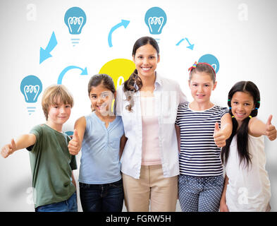 Image composite de l'enseignant et élèves cute smiling at camera in computer class Banque D'Images