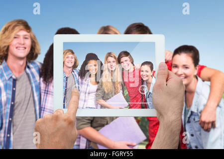 Image composite de hand holding tablet pc Banque D'Images