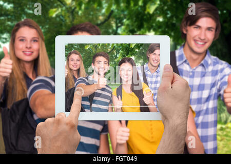 Image composite de hand holding tablet pc Banque D'Images