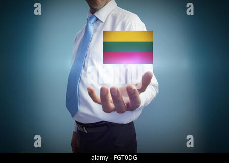 Composite image of businessman holding hand out Banque D'Images