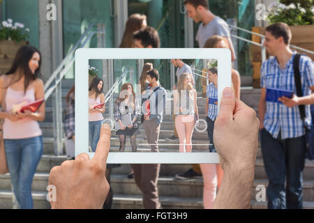 Image composite de hand holding tablet pc Banque D'Images