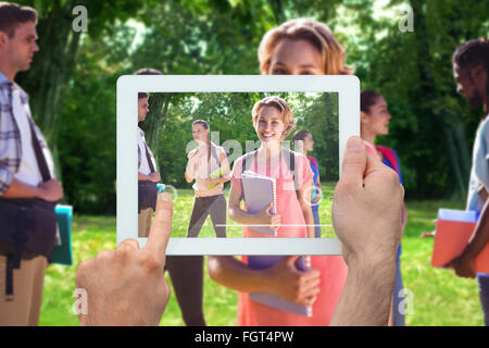 Image composite de hand holding tablet pc Banque D'Images