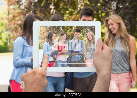 Image composite de hand holding tablet pc Banque D'Images