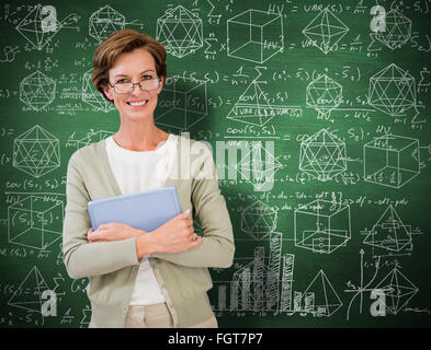 Image composite de teacher holding tablet pc at library Banque D'Images